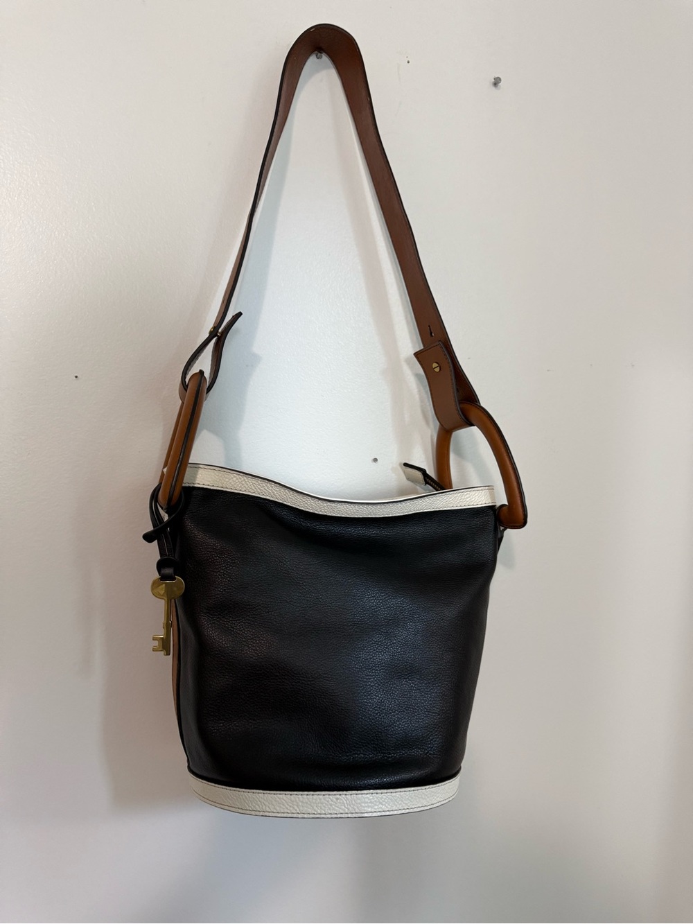 Fossil Black Leather Bucket Bag with White Trim and Brown Strap